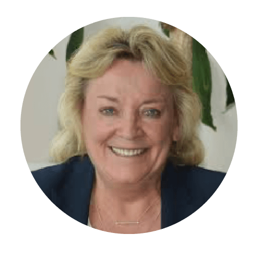 Professional headshot of Jennifer Gertenbach, smiling in front of trees