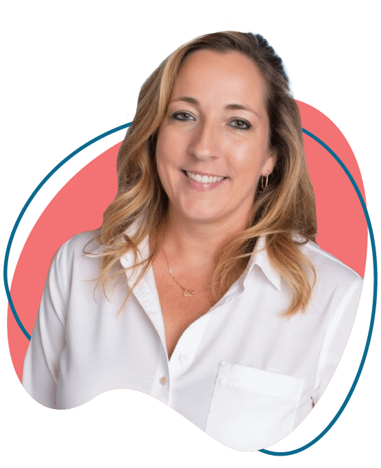 Holly Castellow, multimedia designer and developer at Happily Creative, smiling in front of abstract coral background